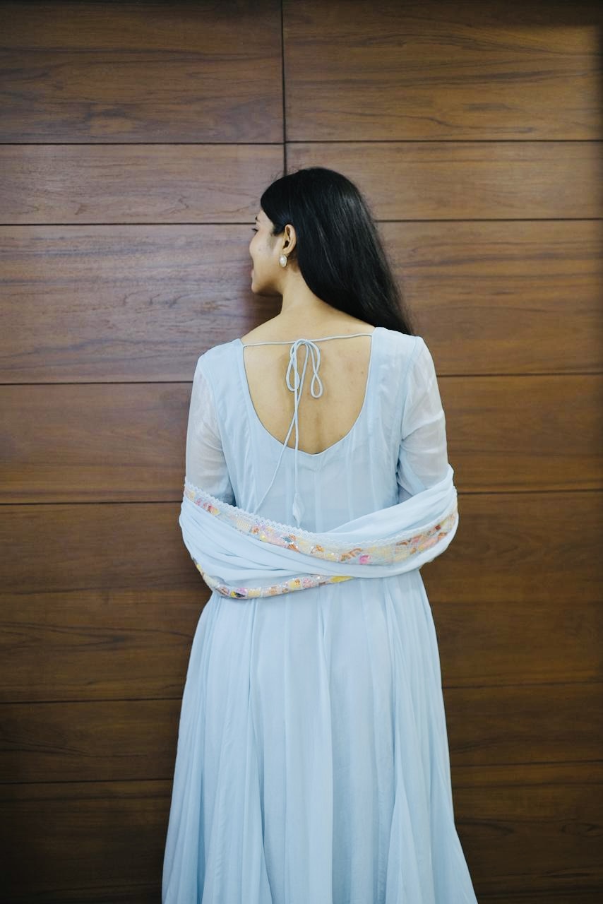 Back view of powder blue anarkali with tie-back detail