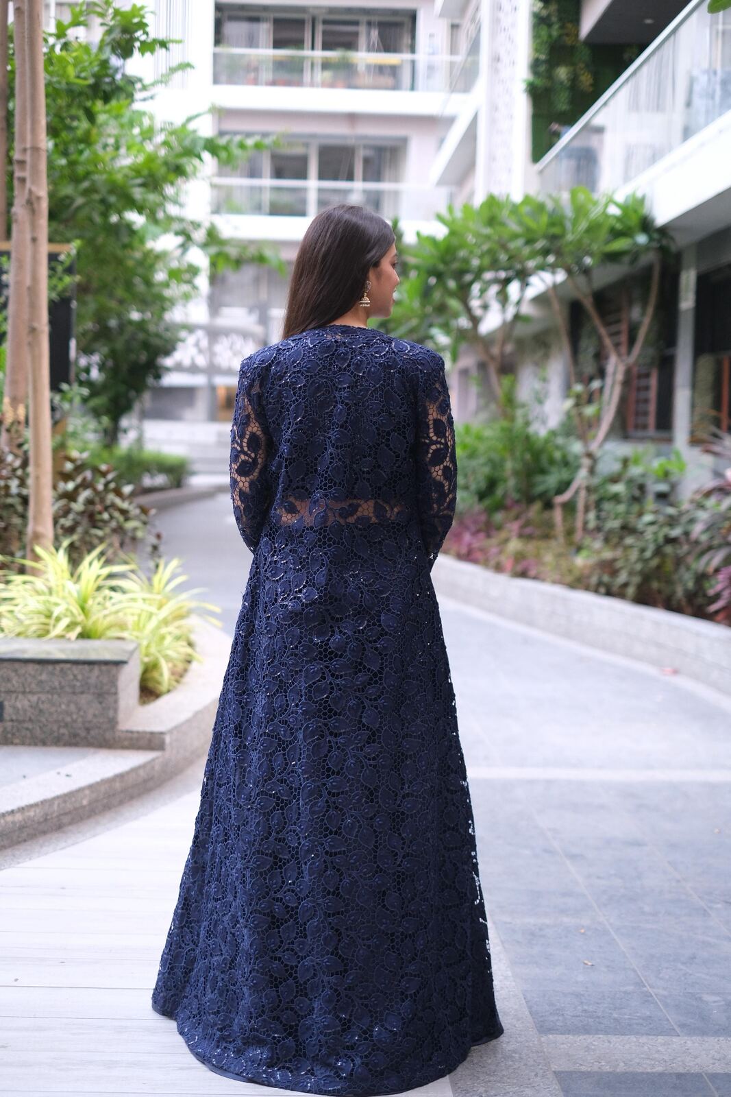 Back view of navy lace floor-length jacket