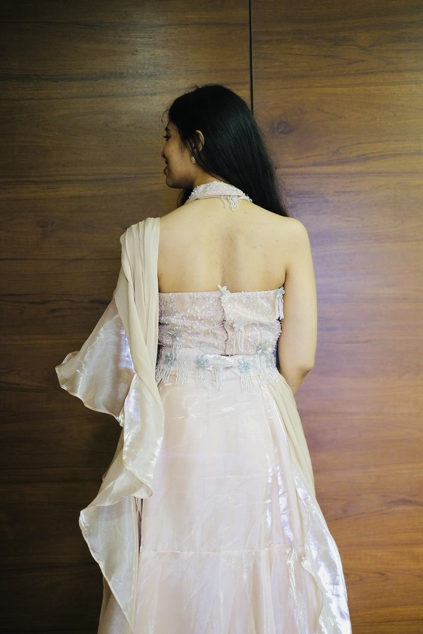 Back view of blush shimmer halter corset gown